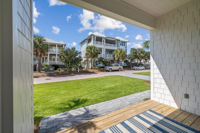 view of yard featuring a balcony