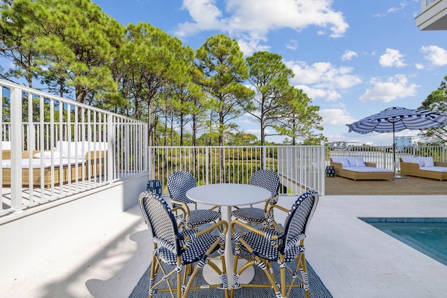 view of patio featuring a fenced in pool