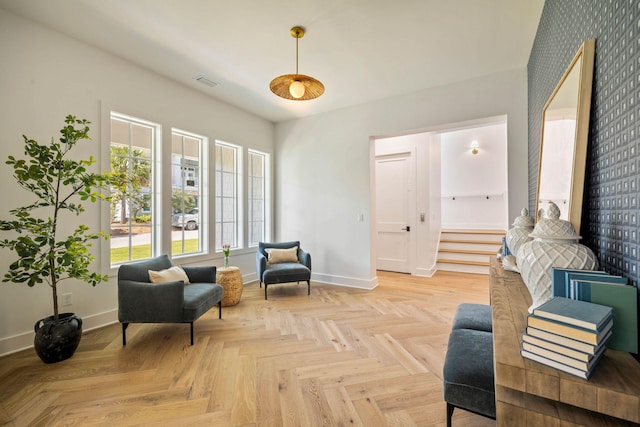 living area featuring light parquet flooring