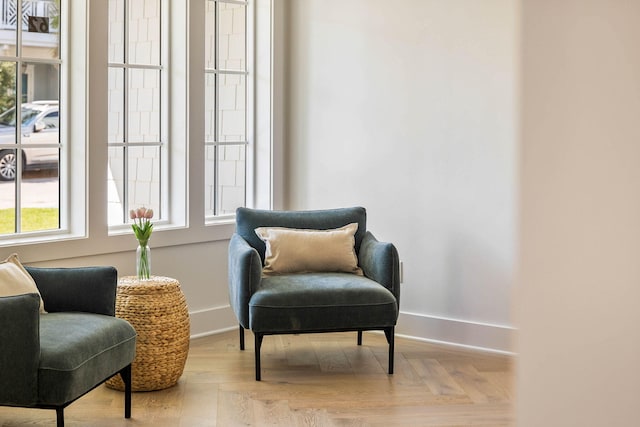 sitting room featuring light parquet floors