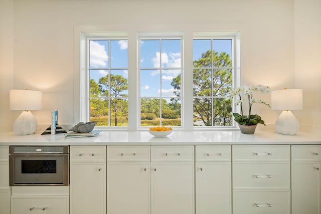 kitchen with white cabinetry and oven