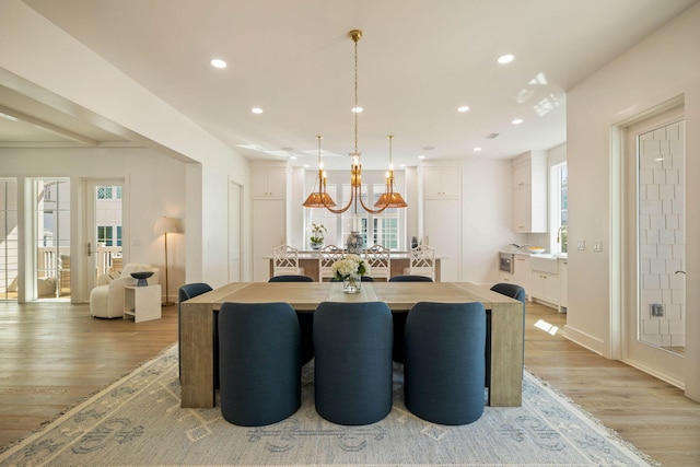 dining area featuring a wealth of natural light and light wood-type flooring