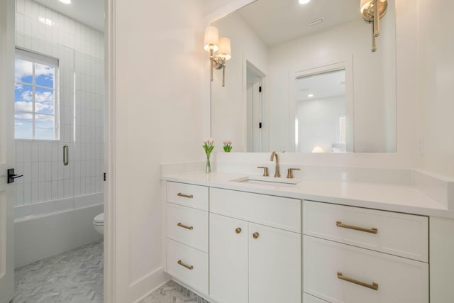 full bathroom with toilet, combined bath / shower with glass door, and vanity