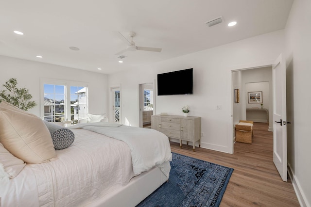 bedroom with light hardwood / wood-style floors and ceiling fan