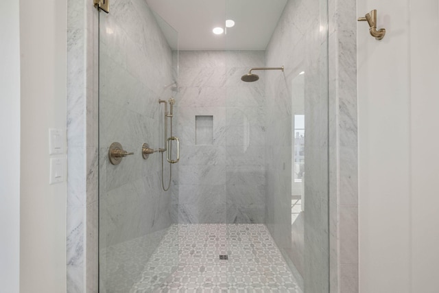 bathroom with a shower with shower door