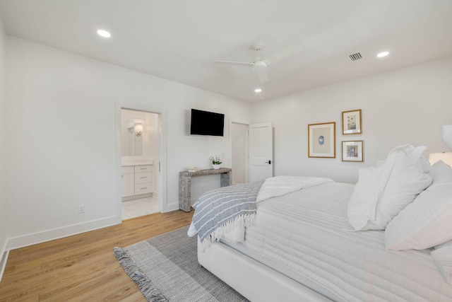 bedroom with light hardwood / wood-style flooring, ensuite bathroom, and ceiling fan