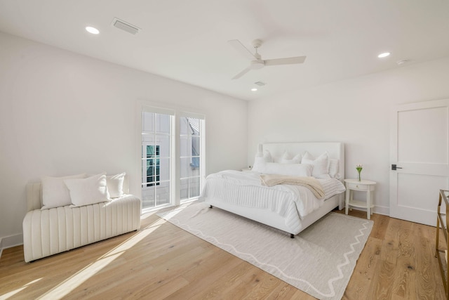 bedroom featuring ceiling fan, access to exterior, and hardwood / wood-style floors