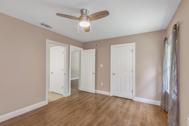 unfurnished bedroom featuring ceiling fan and light hardwood / wood-style floors