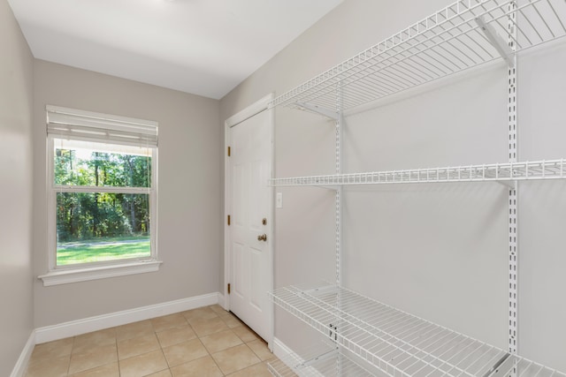 spacious closet with tile patterned floors