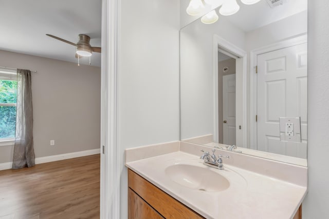 bathroom with vanity, ceiling fan, and wood-type flooring