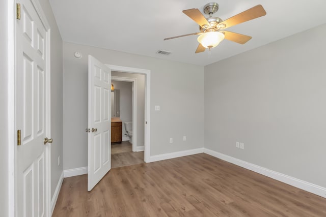 unfurnished bedroom with ceiling fan and light hardwood / wood-style floors