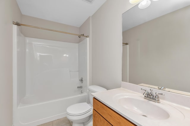 full bathroom featuring tile patterned floors, vanity, bathtub / shower combination, and toilet