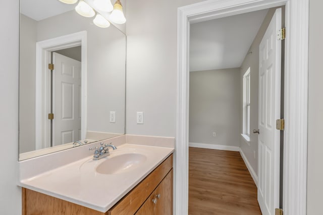 bathroom featuring vanity and hardwood / wood-style flooring