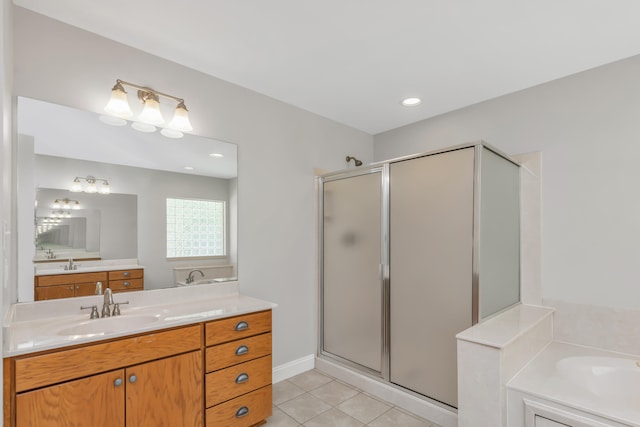 bathroom with vanity, tile patterned flooring, and plus walk in shower