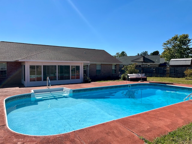 view of swimming pool featuring outdoor lounge area and a patio