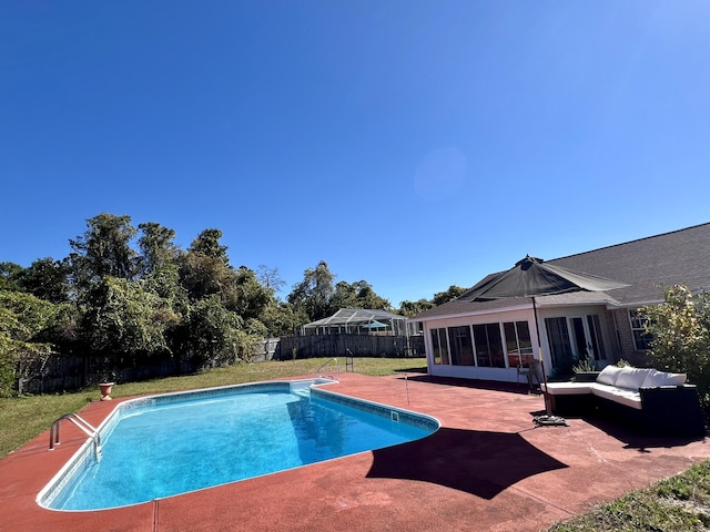 view of pool with a lawn, an outdoor living space, a fenced backyard, a patio area, and a fenced in pool