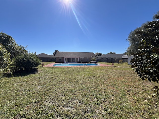 view of yard with a fenced backyard and a fenced in pool