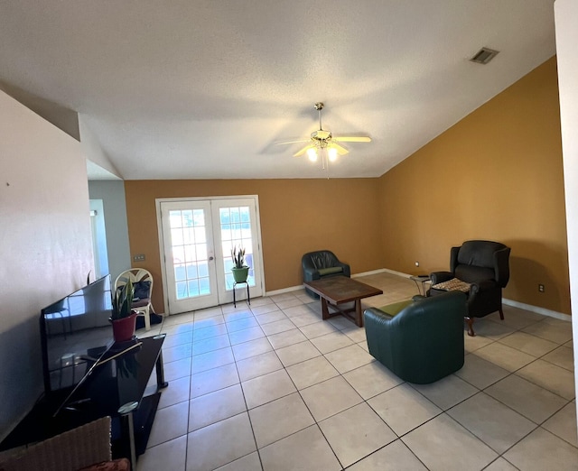 living area with visible vents, french doors, lofted ceiling, and ceiling fan