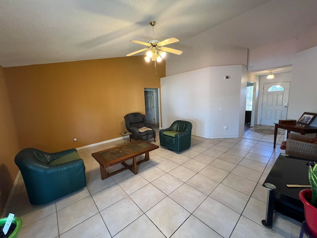 tiled living room with a textured ceiling, high vaulted ceiling, and ceiling fan