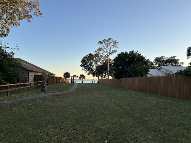 yard at dusk with fence