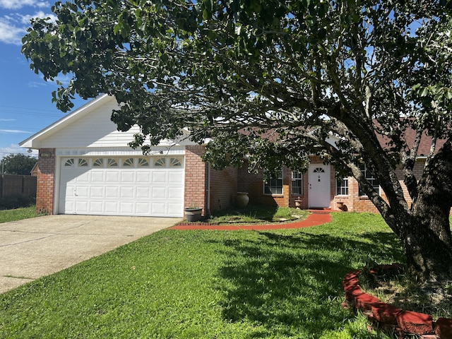 view of front of property featuring a garage and a front yard