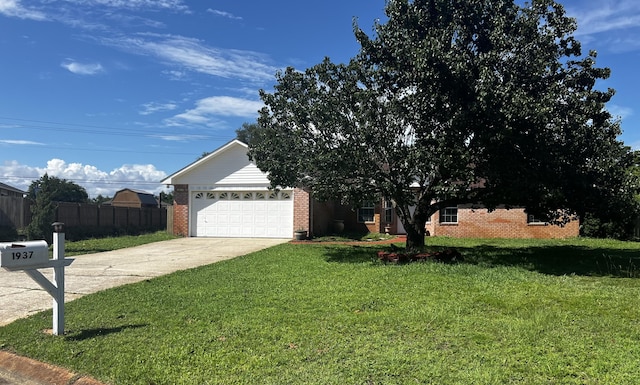 view of front of house featuring a garage and a front lawn