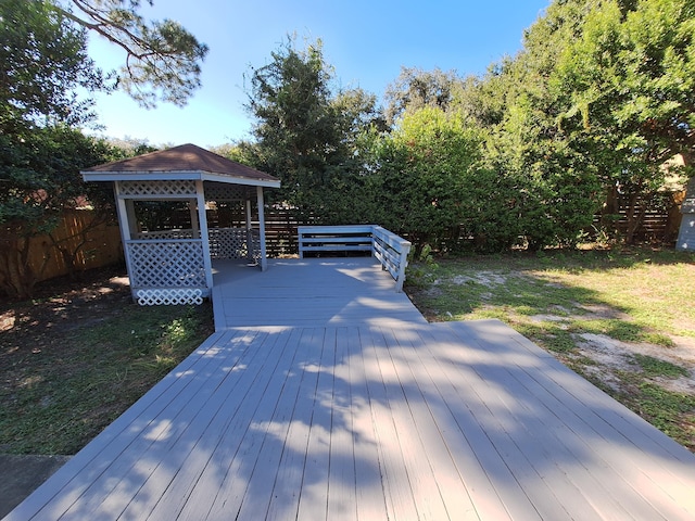 deck with a gazebo and a yard