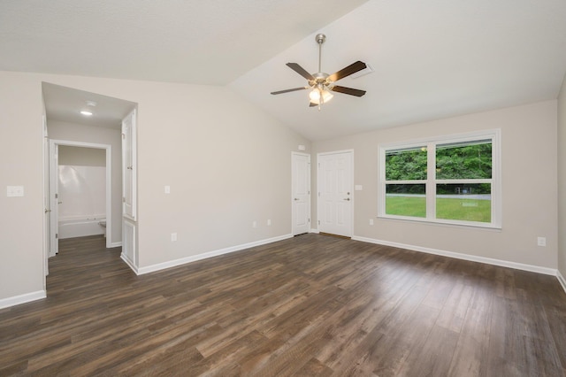 unfurnished room with dark wood-type flooring, ceiling fan, and vaulted ceiling