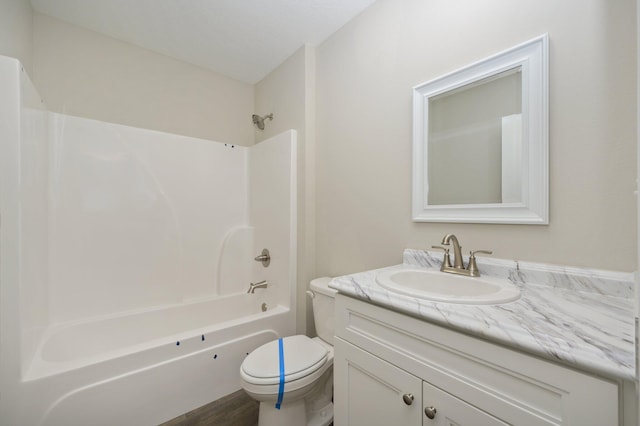 full bathroom featuring vanity, toilet, shower / bathing tub combination, and hardwood / wood-style floors