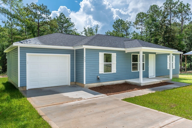 single story home with a front yard and a garage