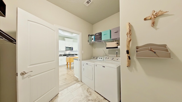 laundry room with washer and dryer