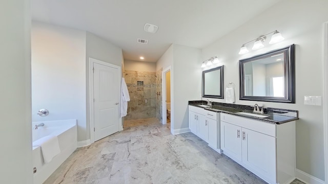 bathroom with vanity and plus walk in shower