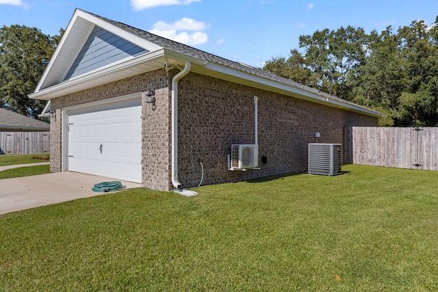 view of side of property with a lawn, central air condition unit, and ac unit