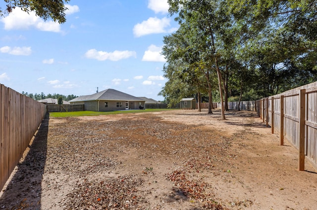 view of yard with a storage unit