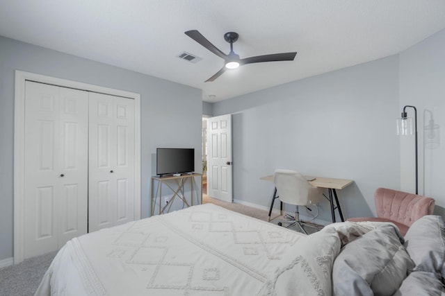 bedroom with carpet floors, a closet, and ceiling fan