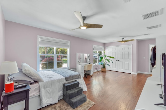 bedroom featuring dark hardwood / wood-style flooring and ceiling fan