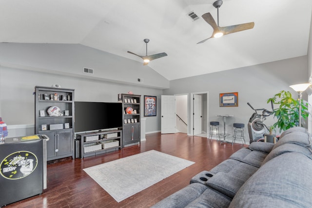 living room featuring lofted ceiling, dark wood-type flooring, and ceiling fan