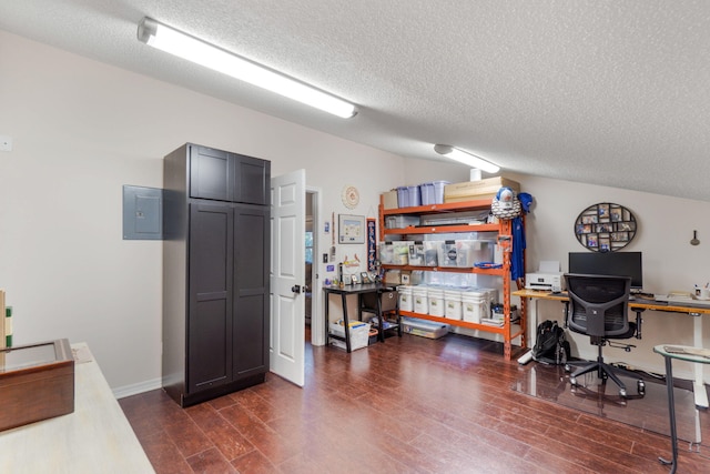 office area with a textured ceiling and dark hardwood / wood-style floors