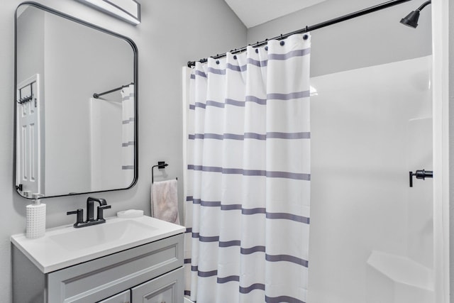 bathroom featuring vanity and walk in shower