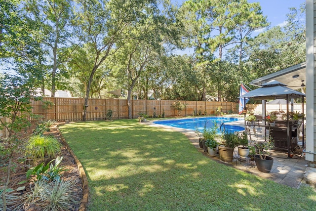 view of yard featuring a gazebo and a fenced in pool