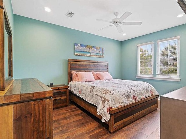 bedroom featuring ceiling fan and dark hardwood / wood-style floors