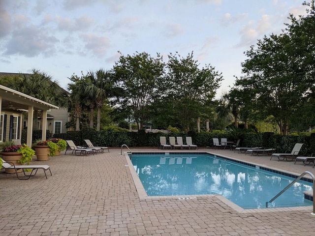 view of swimming pool with a patio area