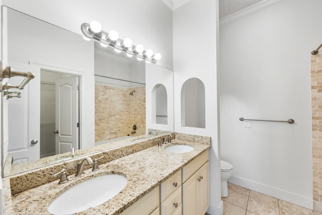 bathroom featuring tile patterned floors, toilet, vanity, and ornamental molding