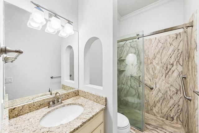 bathroom with crown molding, a textured ceiling, toilet, a shower with door, and vanity