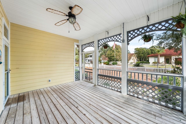 wooden terrace featuring ceiling fan and a porch