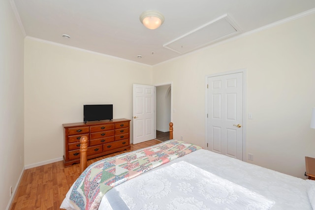 bedroom featuring hardwood / wood-style floors and crown molding