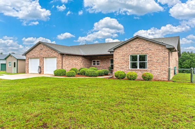 single story home with a garage and a front lawn