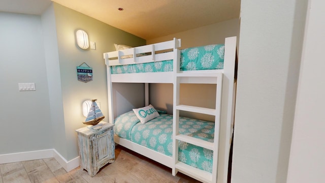 bedroom with light wood-type flooring