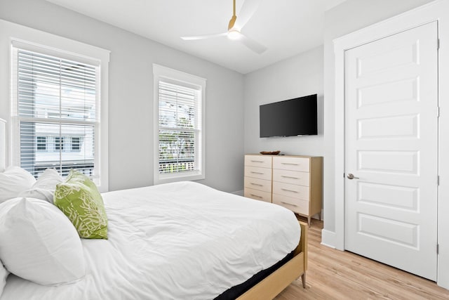 bedroom with wood-type flooring and ceiling fan