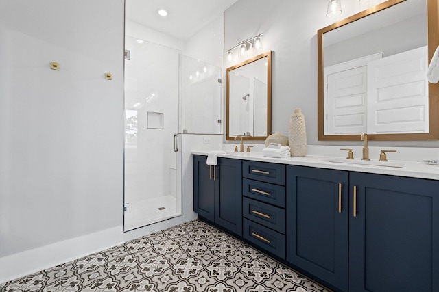 bathroom with a shower with door and vanity